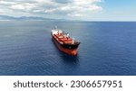 Small photo of Aerial drone photo of huge bulk carrier tanker anchored in deep blue Aegean sea