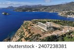 Small photo of Aerial drone photo of iconic archaeological site of Cape Sounio and famous Temple of Poseidon built uphill overlooking Aegean sea, Attica, Greece