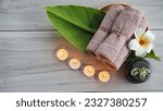 Small photo of Closeup of Spa accessories,Beautiful composition of spa , spa relax concept, herbs for massage, beautiful sap set on wood table,For marketing products