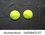 Two Tennis Balls On A Frozen...