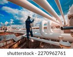 Small photo of Male worker inspection at steel long pipes and pipe elbow in station oil factory during refinery valve of visual check record pipeline tank oil and gas industry