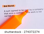 Small photo of bid bond word highlighted on the white paper