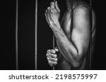 Small photo of prison man crime in gaol, hold hand iron bar jail, punishment convict in justice law, cage for lock freedom, concept for stress, violence