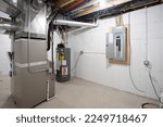 Small photo of Detroit, Michigan -USA- January 12, 2023: home has been updated with a new furnace, hot water tank and electrical panel installed in the basement