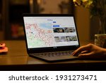 Small photo of Portland, OR, USA - Mar 7, 2021: A man searches for a single family home in the Bay Area from the Zillow website on his laptop at home. The U.S. is seeing the greatest housing price surge since 2006.