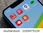 Small photo of Portland, OR, USA - Jan 9, 2022: Yelp, Foursquare, Google Maps, TripAdvisor, OpenTable, and Resy mobile app icons are seen on an iPhone. Restaurant search, reservation, and review concepts.