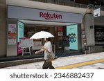 Small photo of Tokyo, Japan - June 17, 2023: Front view of a Rakuten Mobile store in Shibuya, Tokyo. Rakuten Mobile, Inc. is a Japanese mobile network operator and a wholly owned subsidiary of Rakuten.