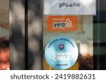 Small photo of Chula Vista, CA, USA - May 14, 2022: Find us on Yelp and Choose Chula stickers are seen on the door at a store in Chula Vista, California. Yelp publishes crowd-sourced reviews about local businesses.