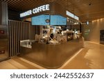 Small photo of Beijing, China - July 22, 2023: A Manner Coffee kiosk in the Huamao Shopping Center in Beijing, China. Manner Coffee is a Chinese coffee chain.
