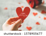 Valentine's Day postcard. Love concept for mother's day and valentine's day. Happy Valentine's day hearts on wooden background. Valentine card with space for text
