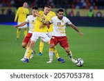 Small photo of BUCHAREST, ROMANIA - OCTOBER 11, 2021: Ishkhan Geloyan and Nicusor Bancu during the FIFA World Cup Qatar 2022 qualification football match between Romania and Armenia.