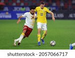 Small photo of BUCHAREST, ROMANIA - OCTOBER 11, 2021: Nicusor Bancu and Ishkhan Geloyan during the FIFA World Cup Qatar 2022 qualification football match between Romania and Armenia.