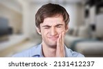 Small photo of Healthcare concept, man hand on face as suffering from facial pain, mumps or toothache