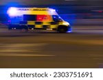 Small photo of Leicester, United Kingdom- May 13, 2023: A motion panning blur of am HM Ambulance in pursuit.