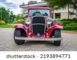 Small photo of Highlands, NC - June 10, 2022: Low perspective front view of a 1932 Chevrolet Rumble Seat Coupe at a local car show.