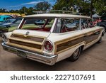 Small photo of Des Moines, IA - July 02, 2022: High perspective rear corner view of a 1963 Ford Country Squire Station Wagon at a local car show.