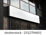 Blank white restaurant or shop sign mockup, large billboard banner on a storefront template.