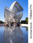 Small photo of PARIS, FRANCE, October 15, 2017 - (Louis Vuitton Foundation) museum by Frank Gehry. Front view of Fondation Louis Vuitton with reflection in pool on October 15 in Paris, France