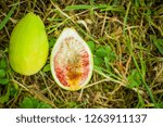 Small photo of fig cut in two, outside and inside