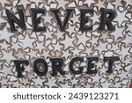 Small photo of Doylestown, PAUSA March 14,2024. The sign says, "Never Forget", which is a good reminder to all of us.
