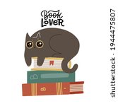 cute funny cat luing on book... | Shutterstock .eps vector #1944475807