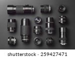 Collection of camera lens well organized over black background