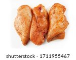 Raw chicken marinated fillet isolated on a white background. Raw chicken breast fillets. top view with copy space. Flat lay composition with raw chicken breasts. Space for text. Meat shop.