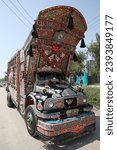 Small photo of ISLAMABAD, PAKISTAN – MAY 19, 2023: Traditional national truck in Islamabad city, Pakistan