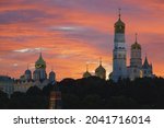 Moscow downtown. Kremlin Tower,  Ivan the Terrible Bell-Tower, Dormition Cathedral. Beautiful view. Landmark in capital of Russian Federation during pink sunset. Sutable for touristic guide, postcard