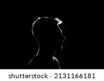 Small photo of dark backlight shadow silhouette of male person, incognito unknown profile