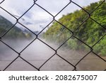 Chain Link Fence With Cobwebs