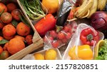 Small photo of Food Waste. Fruits and vegetables are wasted by suppliers, retailers, and consumers. Throwing out food that cant be sold. Discarded unsold damaged fruits and vegetables in packages