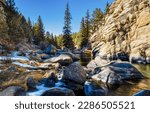 Small photo of River stones in a mountain river. Mountain river rocks. Rock in mountain river. Mountain river stream