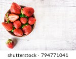 Strawberries In Wooden Bowl On...