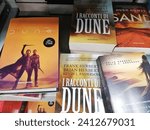 Small photo of Rome, Italy - January 12, 2024, detail of the covers of some books inspired by the 1965 science fiction novel Dune by Frank Herbert.