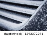 the frozen grille of the car. the silver grille of the car in the snow