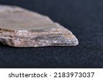Small photo of Schist is a medium-grained metamorphic rock showing pronounced schistosity.