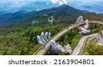 Small photo of Da Nang, Vietnam - June 2nd 2022: The Golden Bridge is lifted by two giant hands in Ba Na Hills which is a favorite destination for.