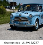 Small photo of URBINO, ITALY - JUN 16 - 2022 : FIAT 1100 103 TV BERLINA 1954 on an old racing car in rally Mille Miglia 2022 the famous italian historical race (1927-1957)