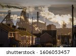 Small photo of Editorial PORT TALBOT, UK - JANUARY 04, 2020: The houses of Port Talbot and the emmisions of the TATA Steel works that provides employment for the townsfolk.