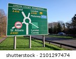 Sign for London Colney Roundabout with directions for Hatfield, London, St. Albans and London Colney