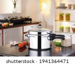 Stainless Steel Pressure Cooker in kitchen background