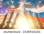 Shadows of missile warheads on the background of Russian and American flags. Sunset in the background. The concept of a military conflict between USA and Russia.