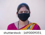 Small photo of Bhopal Madhya Pradesh India 20-march-2020 Arti Malviya in black Mask as protection from Noval Corona Virus