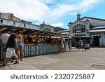 Small photo of La Rochelle, France - August 1 2022: shoppers buy fruit and vegetables in La Rochelle's 19th century central market.