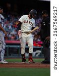 Small photo of San Francisco - June 8, 2022: Colorado Rockies catcher Elias Diaz watches as San Francisco Giants Joc Pederson and home plate umpire Alan Porter laugh during a game at Oracle Park.