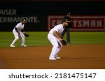 Small photo of Oakland, California - July 5, 2022: Oakland Athletics shortstop Elvis Andrus and third baseman Sheldon Neuse during a game against the Toronto Blue Jays at the Oakland Coliseum.