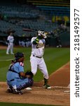 Small photo of Oakland, California - July 5, 2022: Oakland Athletics shortstop Elvis Andrus bats against the Toronto Blue Jays at the Oakland Coliseum.