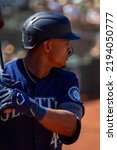 Small photo of Oakland, California - August 21, 2022: Seattle Mariners outfield Julio Rodriguez stands in the on deck circle during a game against the Oakland Athletics at the Oakland Coliseum.