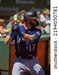 Small photo of Oakland, California - August 21, 2022: Seattle Mariners outfield Mitch Haniger stands in the on deck circle during a game against the Oakland Athletics at the Oakland Coliseum.